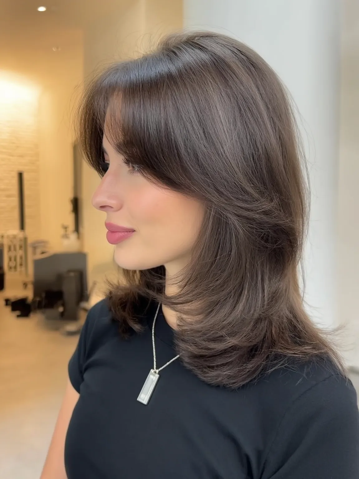 Shoulder-Length Straight Feathered Layers with Curtain Bangs